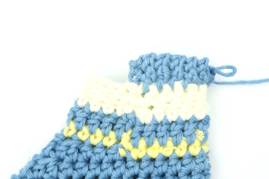 Adding the final edge of the crochet baby booties