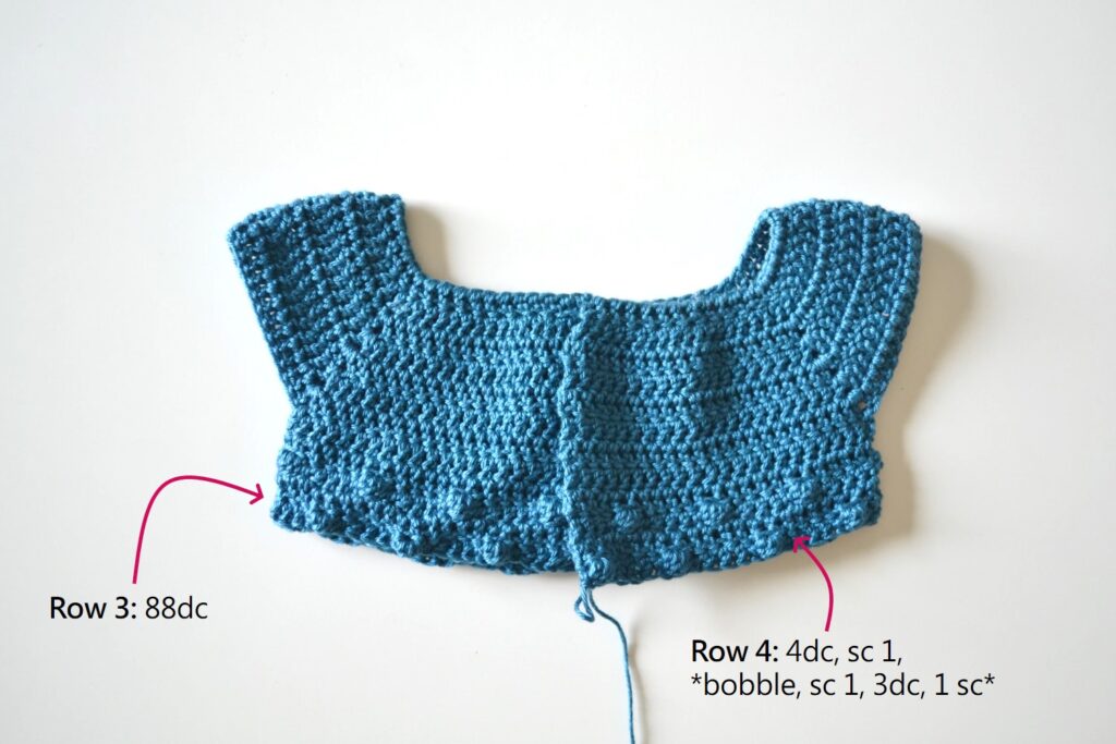 alternating bobble rows on the body of the easy crochet baby cardigan pattern