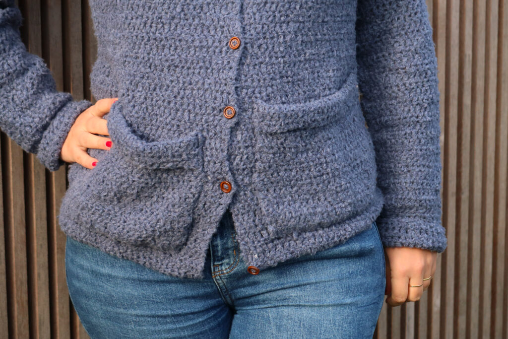 close up of the bottom part of the hooded cardigan and pockets