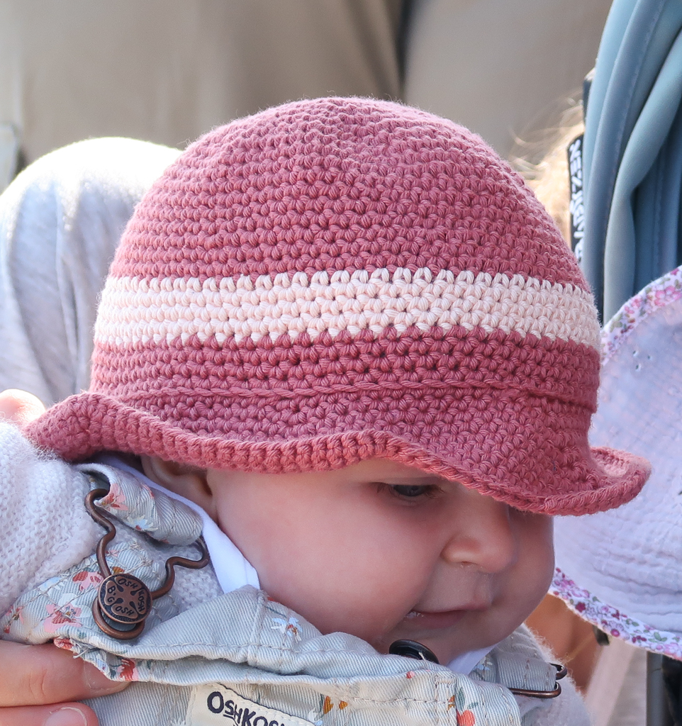 Baby girl wearing her derby summer crochet hat pattern
