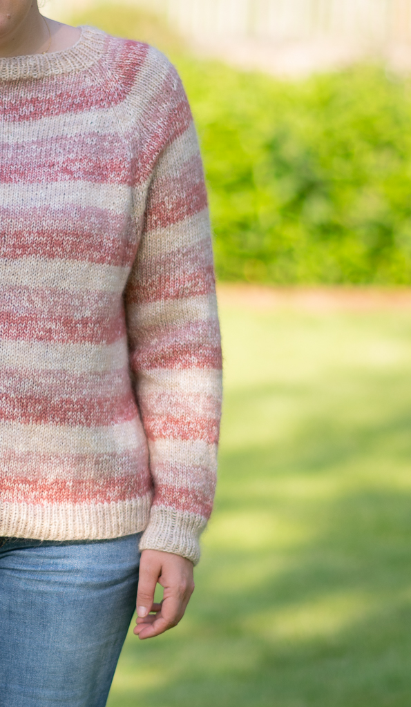 focus on one arm and the raglan yoke of this jumper knitting pattern FREE