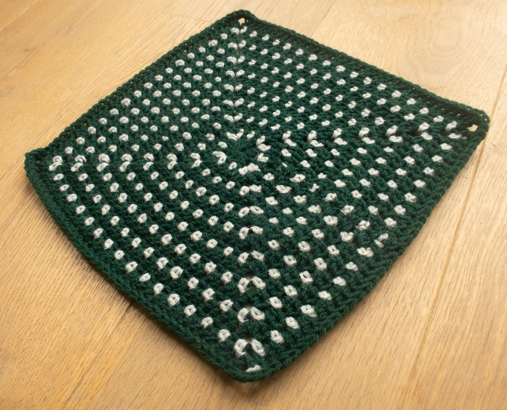 free crochet granny square viewed at an angle