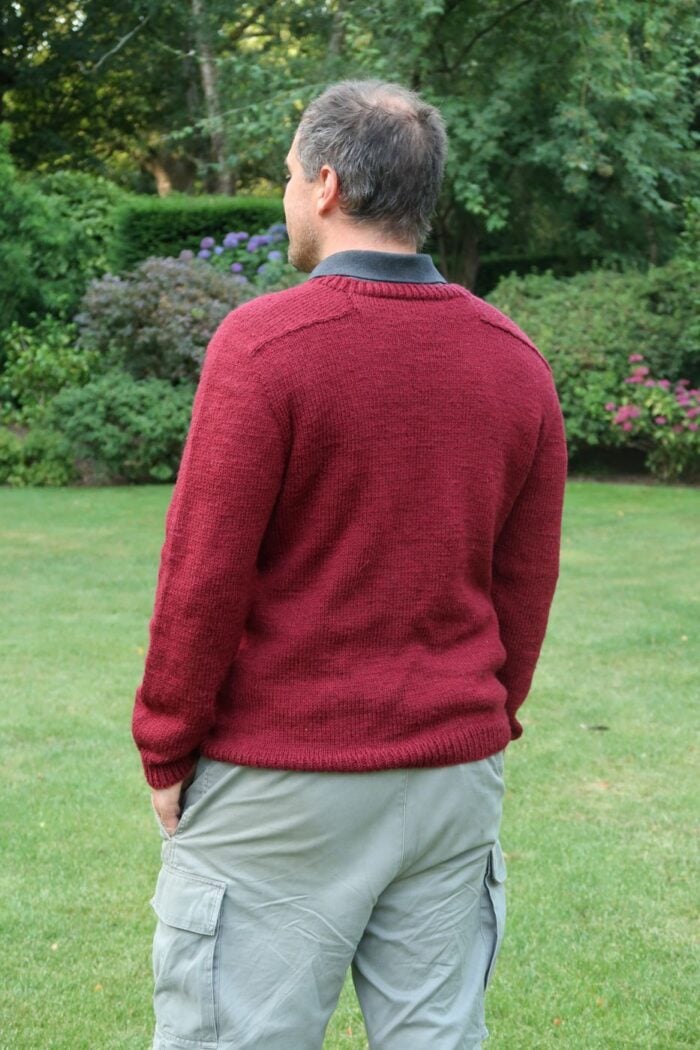 Back view of the finished sweater from this knitting pattern for mens sweater showing the shoulder shaping
