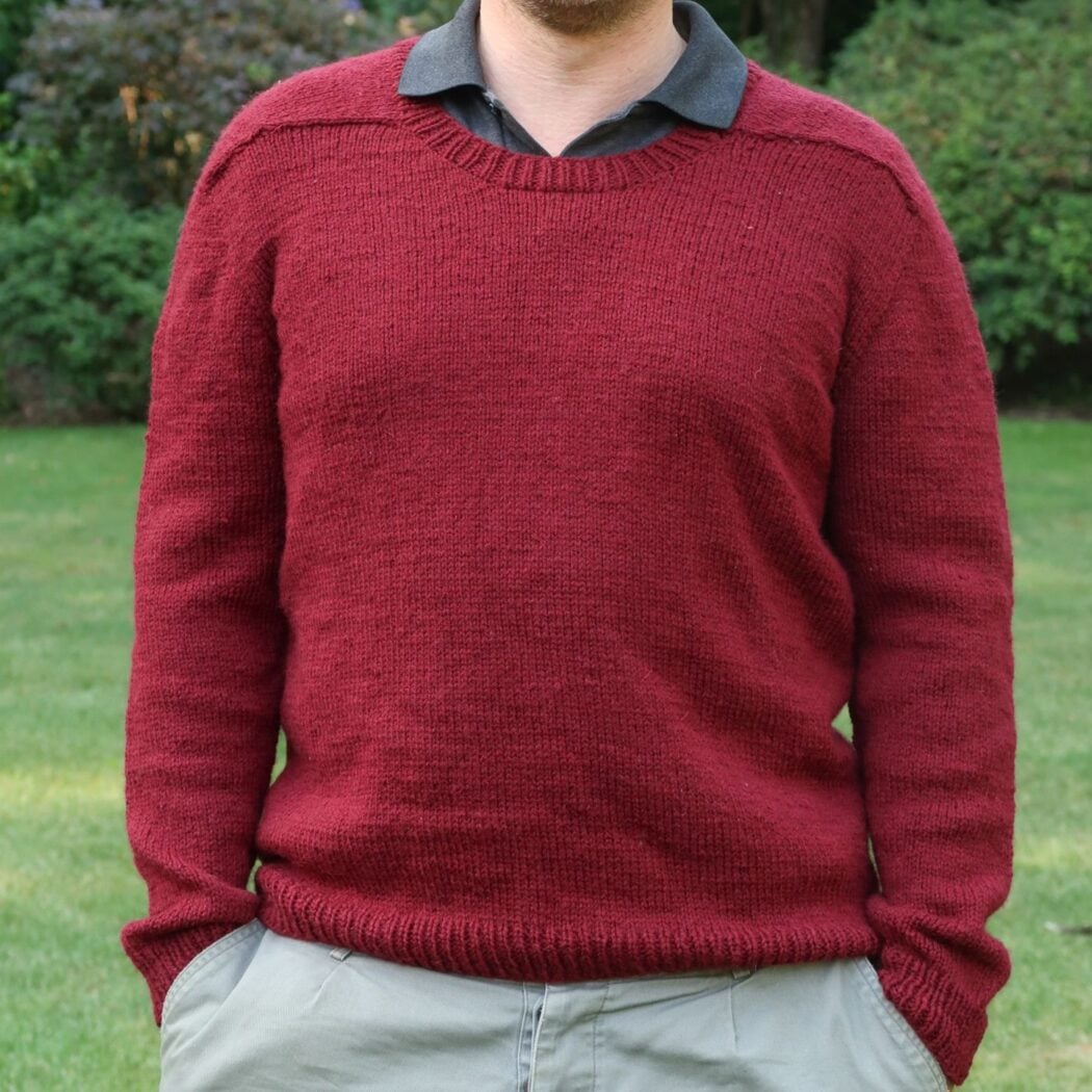 Close view of the smooth stockinette fabric and hem ribbing knit in Lion Brand Wool-Ease DK