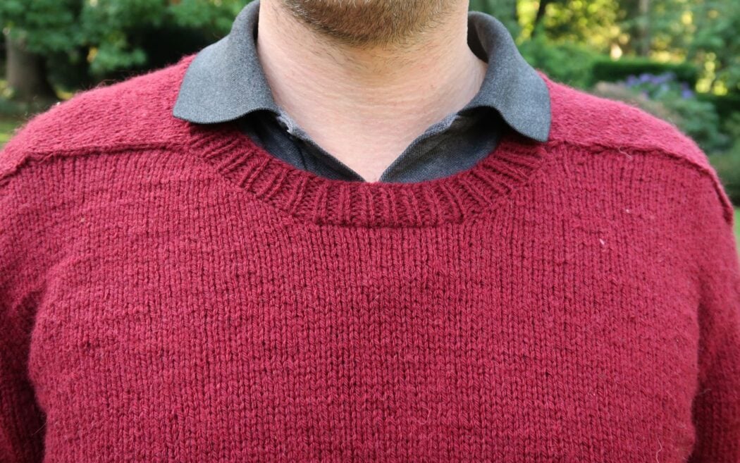 Back neck and saddle shoulder detail of the mens jumper knitting pattern showing the shoulder flap join
