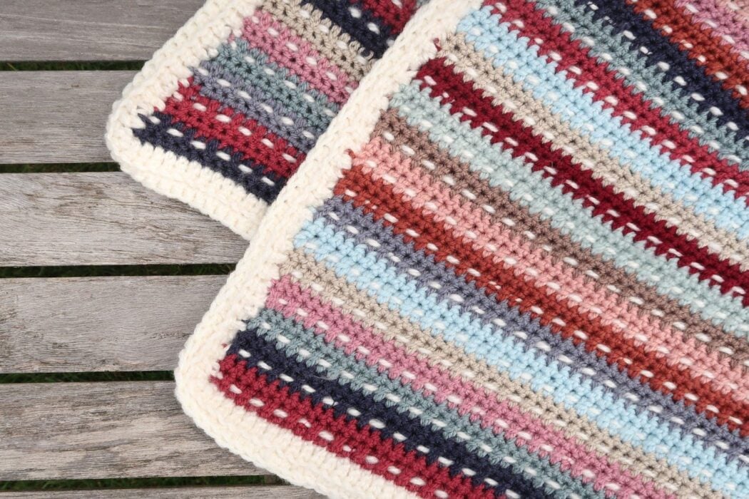 Envelope border corner detail on a granny stripe scrap crochet blanket