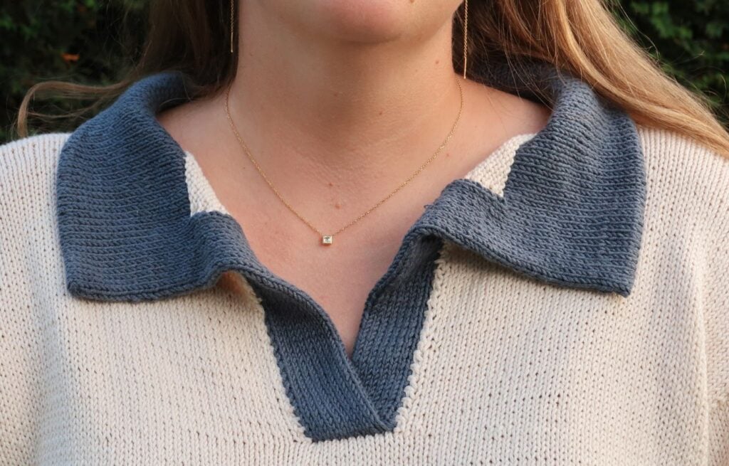 Close-up of the double layered contrast collar on a polo sweater knitting pattern
